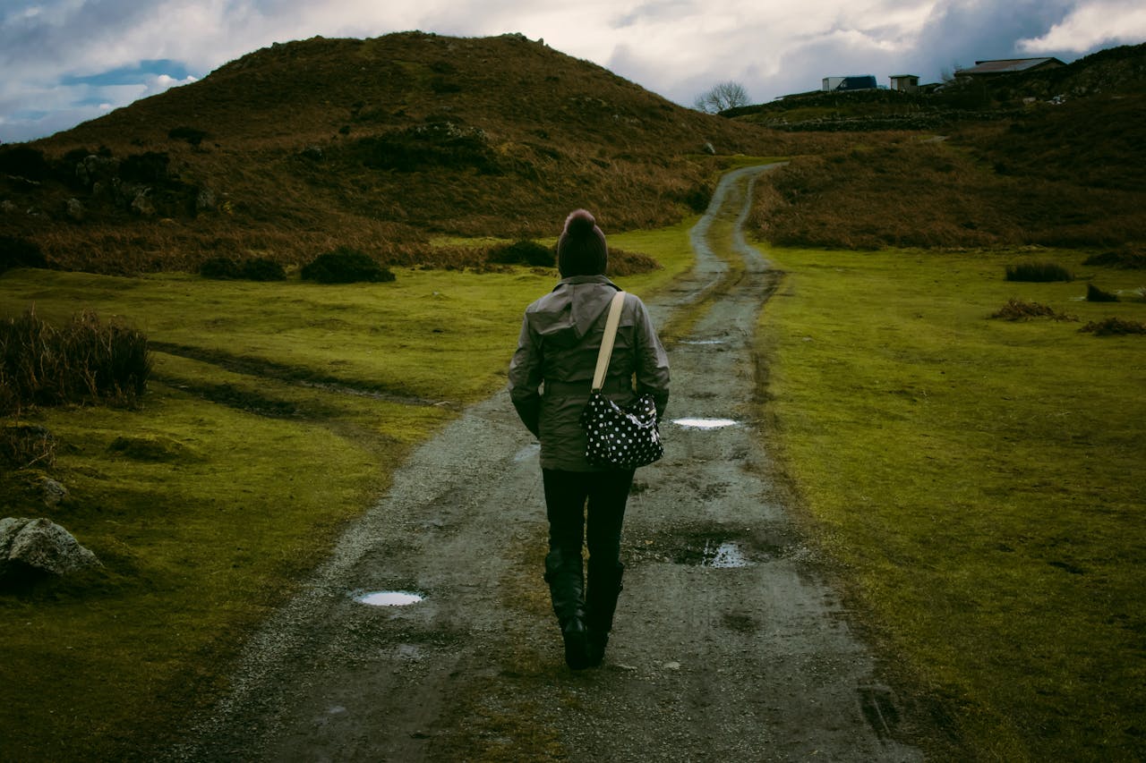 Photo of person walking a road alone at the sunset together by Lisa