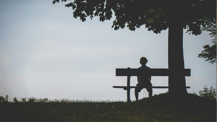 Person sitting alone by Jeswin Thomas